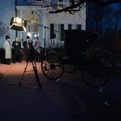 thumbnail image of behind the scenes photo of actors on set.